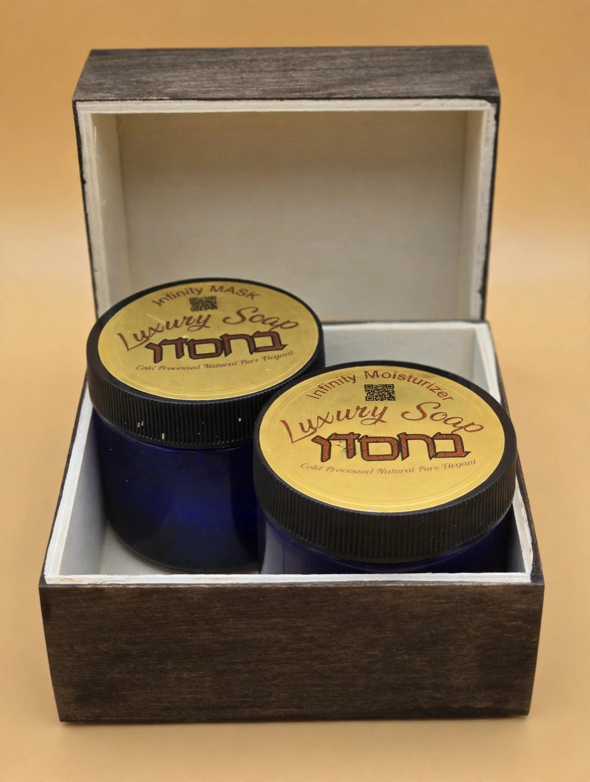 Infinity Moisturizer and Exfoliating Mask Bundle on a gold background, main photo
